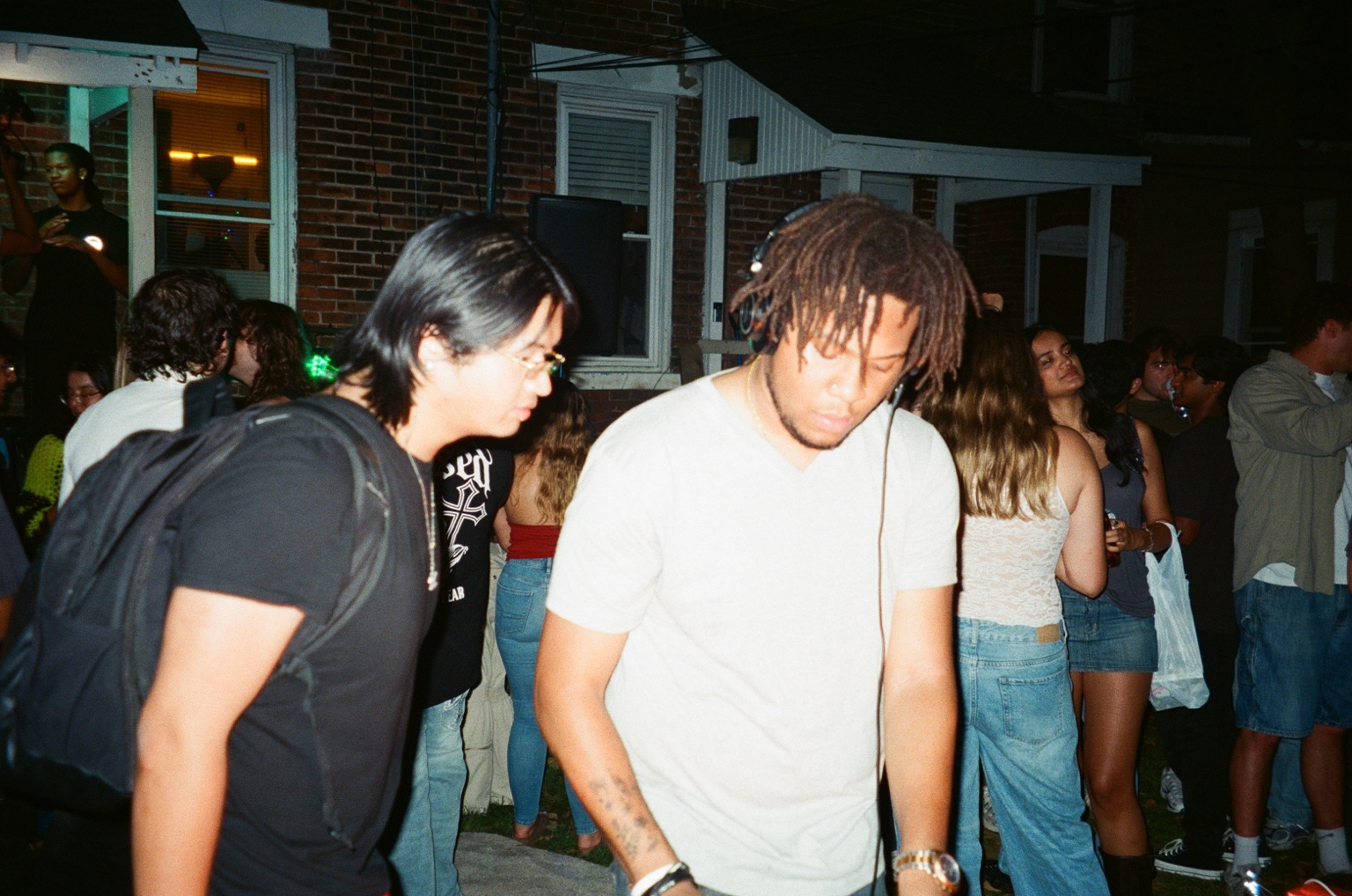 An outdoor DJ set surrounded by friends